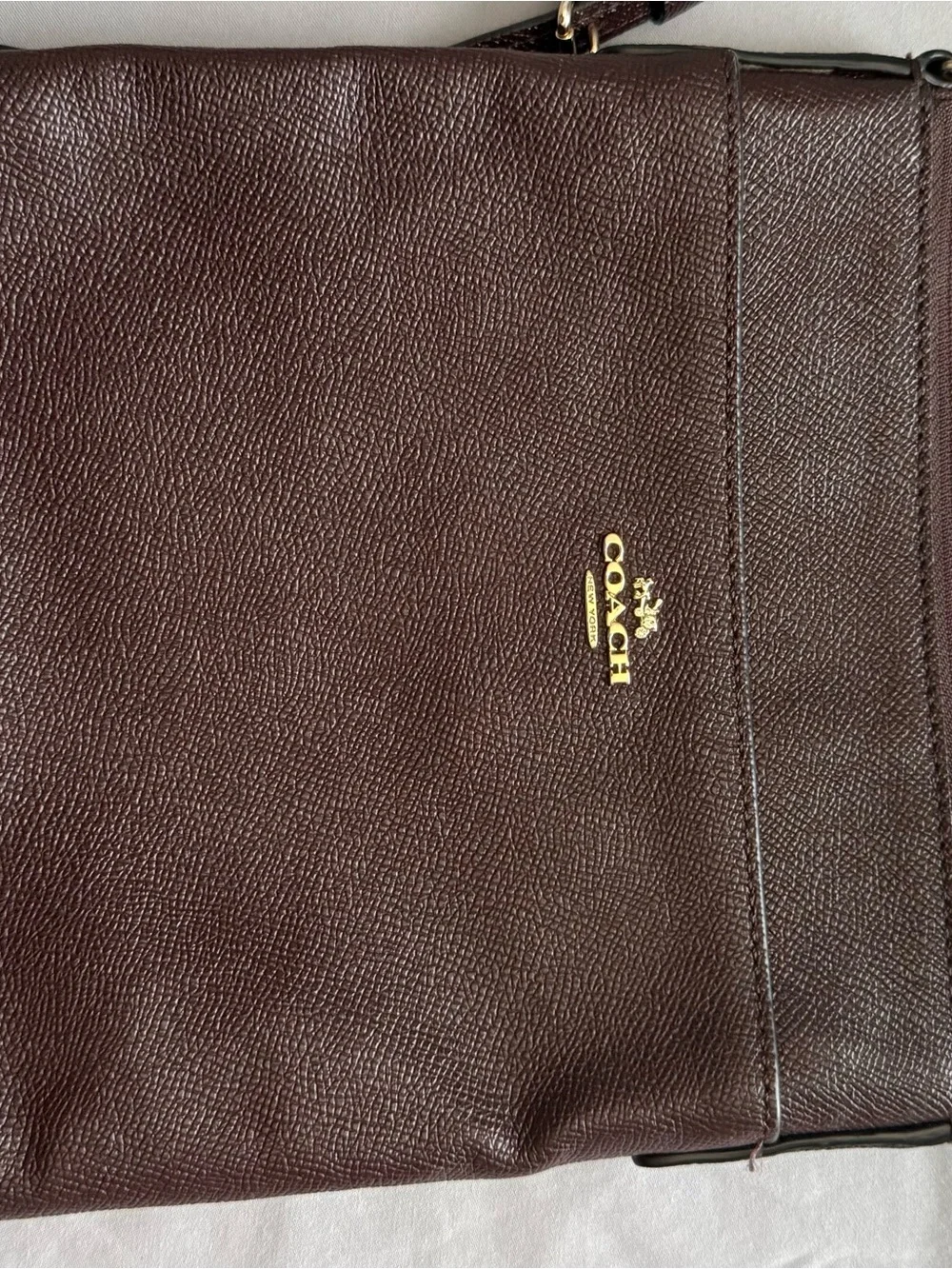 Coach burgundy Pebbled Leather Messenger with Gold Hardware